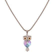 owl silver pendant with cz stones close up white background