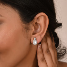 silver earring close up worn by a model