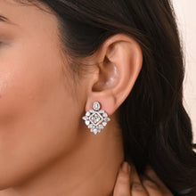 silver necklace and earring set floral earring cz stones in the ear lobes of a model